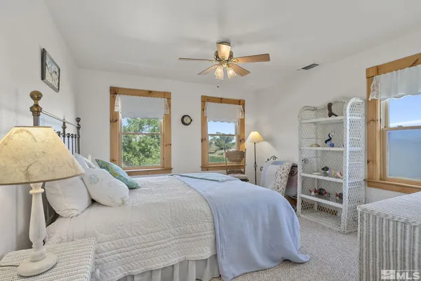 a room with lots of furniture and windows