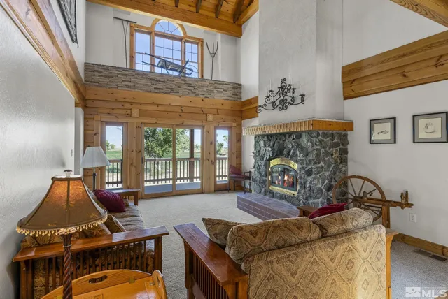 a living room with furniture fireplace and flat screen tv