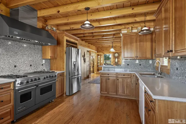 a kitchen with a stove and a sink