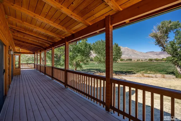 a view of a porch with wooden floor