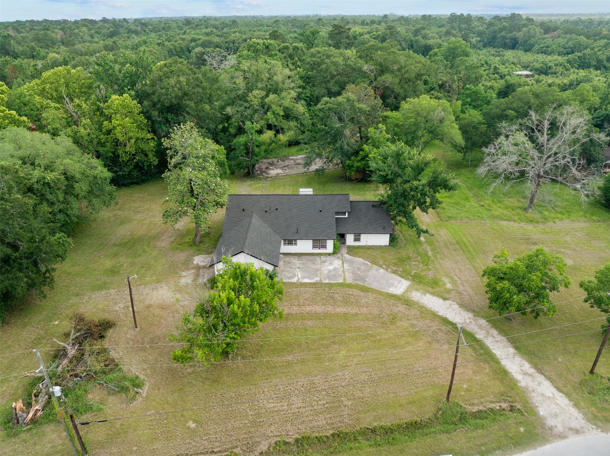 10308 Ehlers Road Conroe, TX 77302 - Photo 1 of 31 a view of a house with a yard