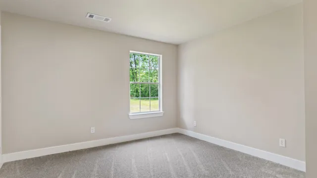 a view of a kitchen with white cabinets
