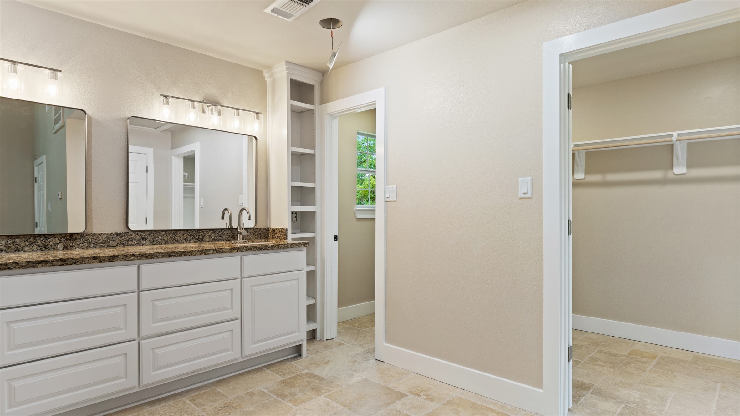 10308 Ehlers Road Conroe, TX 77302 - Photo 20 of 31 a bathroom with a granite countertop sink and a mirror
