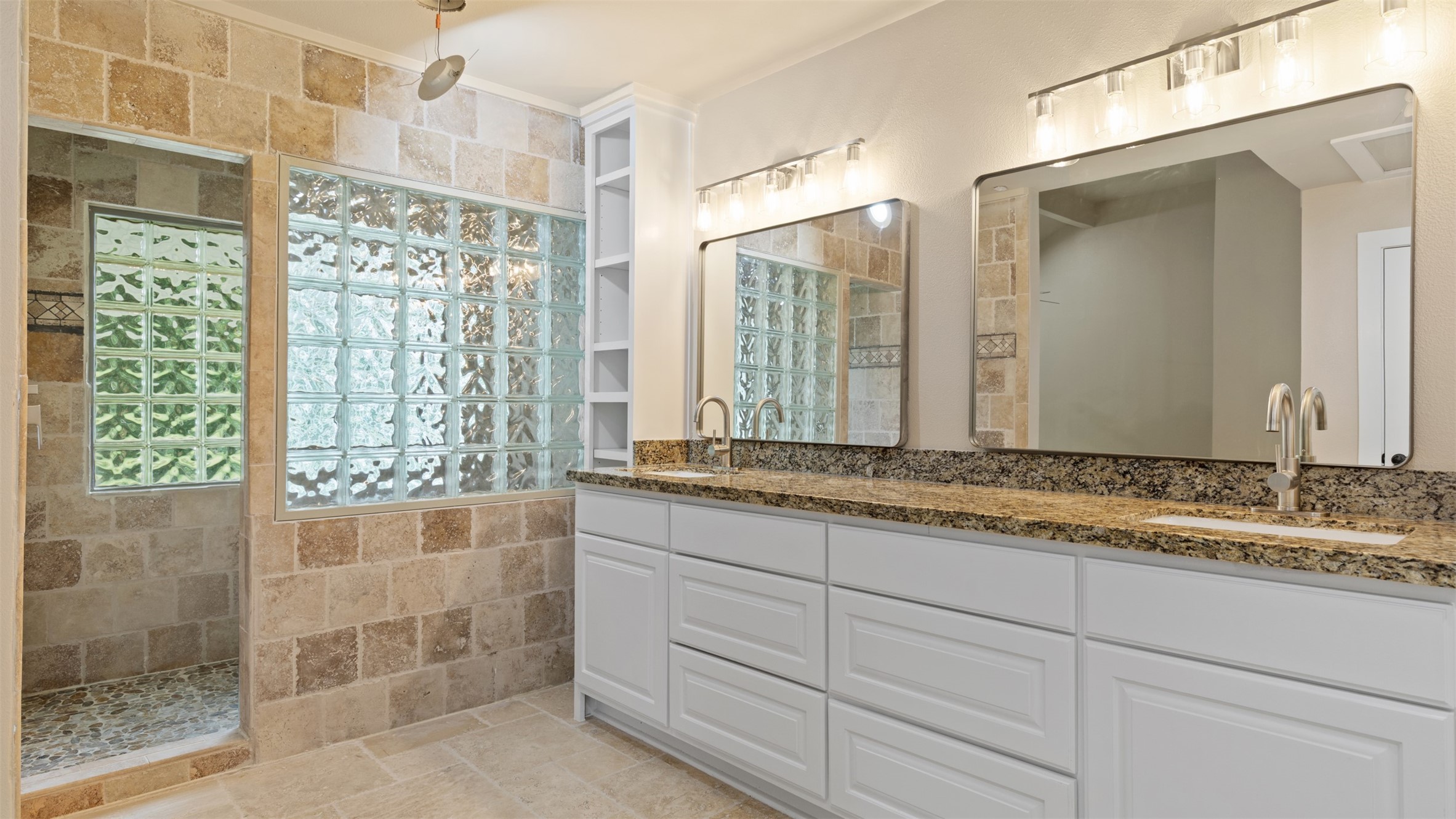 10308 Ehlers Road Conroe, TX 77302 - Photo 21 of 31 a bathroom with a granite countertop sink and a mirror