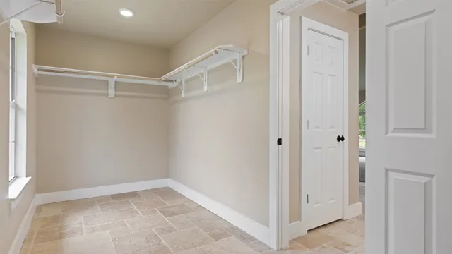 a view of a kitchen with a sink and chandelier fan