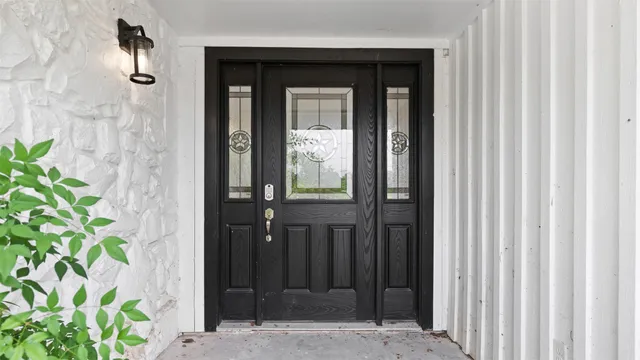 a kitchen with a stove a faucet a chandelier and living room view