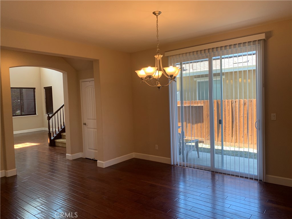538 Burnt Ranch Way Chico, CA 95973 - Photo 12 of 34 a view of a livingroom with wooden floor and a window