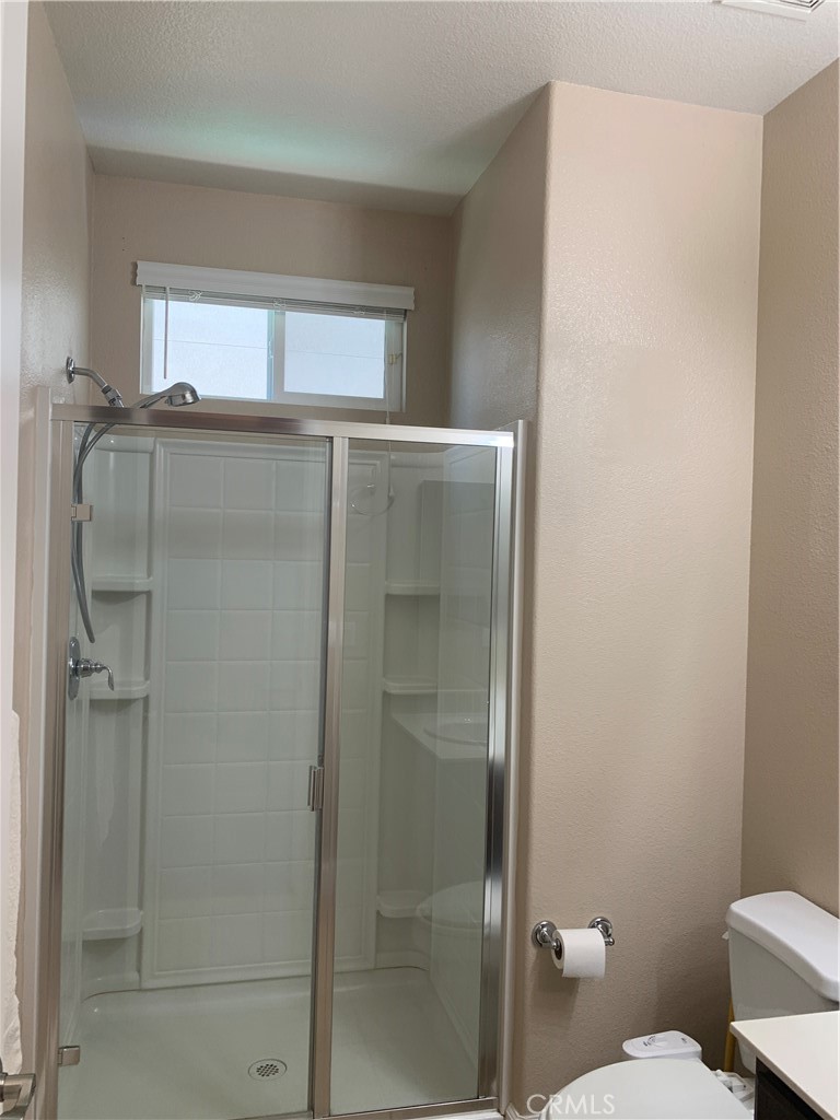 538 Burnt Ranch Way Chico, CA 95973 - Photo 15 of 34 a bathroom with a shower and a toilet
