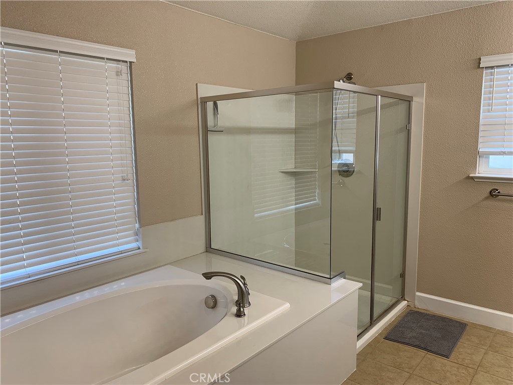 538 Burnt Ranch Way Chico, CA 95973 - Photo 25 of 34 a bathroom with a tub and shower