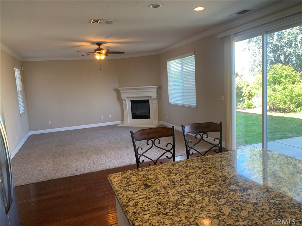 538 Burnt Ranch Way Chico, CA 95973 - Photo 9 of 34 a living room with furniture a window and a flat screen tv
