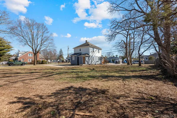 a view of road with large trees