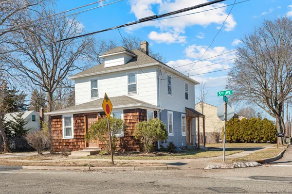 a front view of a building with street view