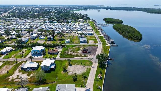 an aerial view of residential houses with outdoor space