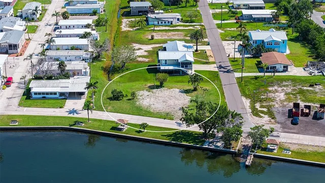 an aerial view of swimming pool outdoor seating and yard