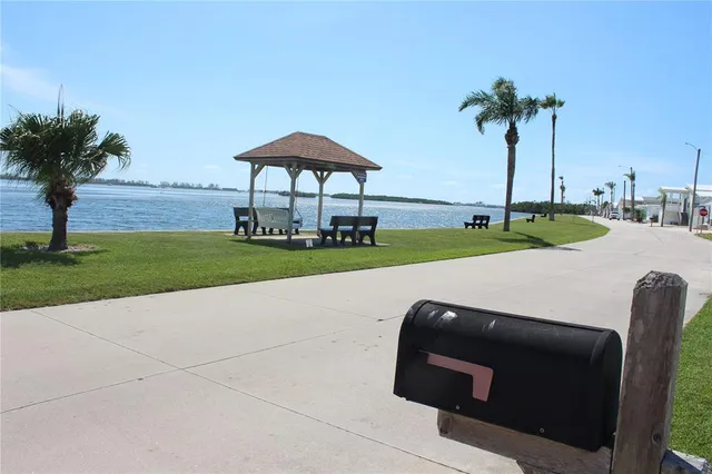 a sign that is in front of flowers