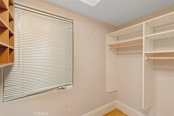 a view of a room that has a window in it