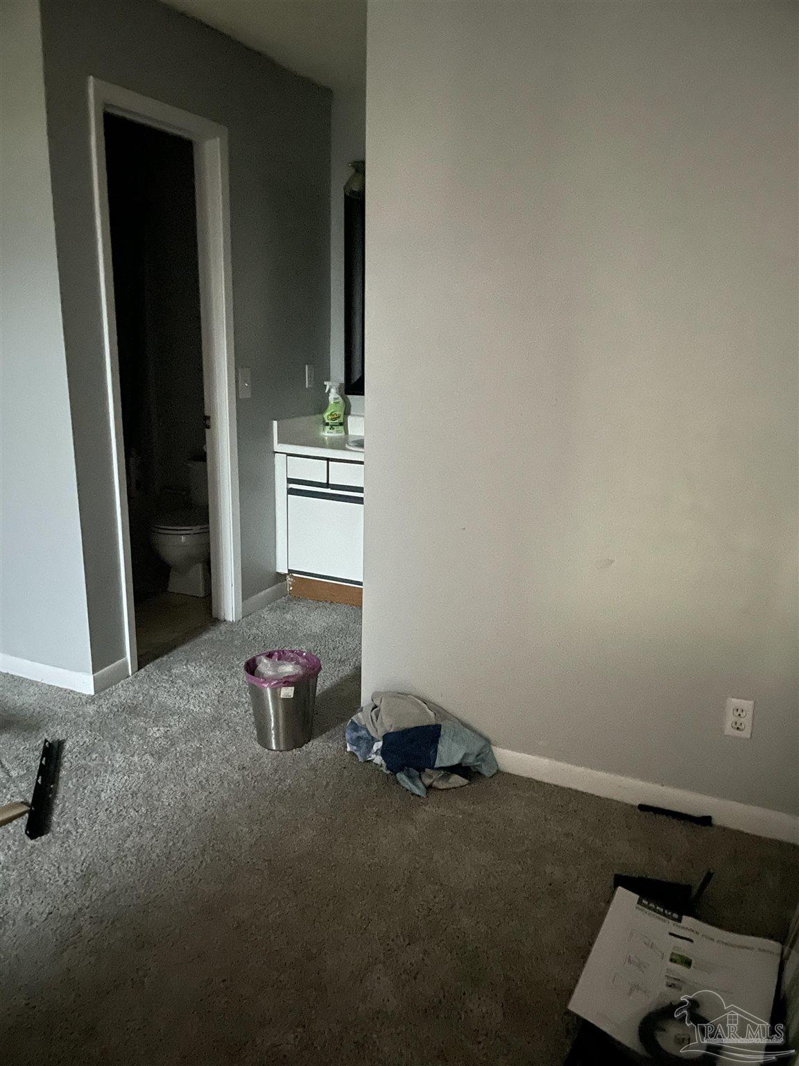 7150 Plantation Road, Unit 327 Pensacola, FL 32504 - Photo 23 of 24 a room with a bed and a mirror