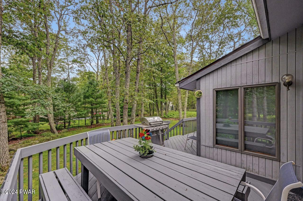 141 Maple Ridge Drive Hawley, PA 18428 - Photo 65 of 84 a view of a deck with wooden floor and outdoor seating