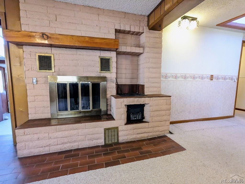 8140 Table Mountain Road Rye, CO 81069 - Photo 12 of 49 a front view of a house with entryway