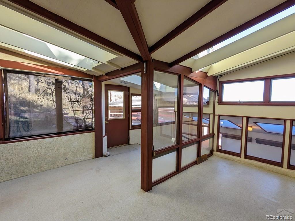 8140 Table Mountain Road Rye, CO 81069 - Photo 19 of 49 a view of an empty room with a large window