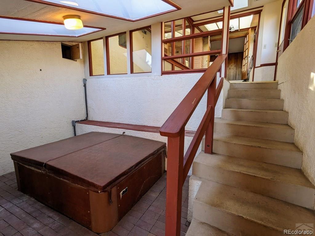 8140 Table Mountain Road Rye, CO 81069 - Photo 21 of 49 a living room with furniture and stairs