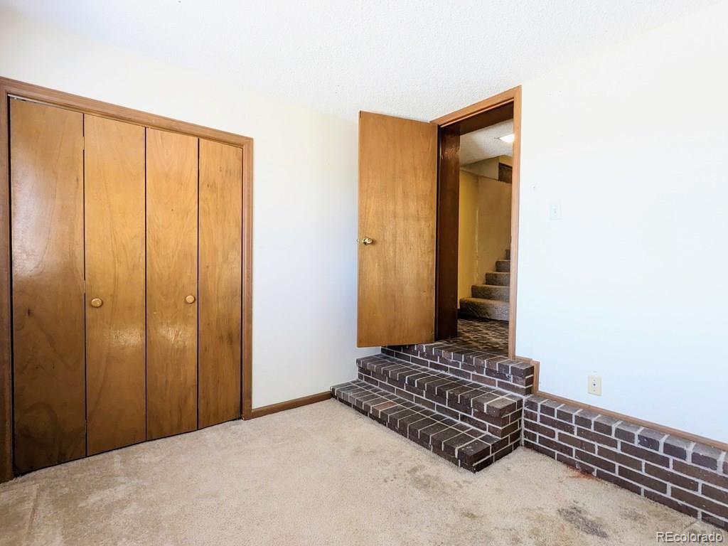 8140 Table Mountain Road Rye, CO 81069 - Photo 22 of 49 a view of a room with a door and a yard