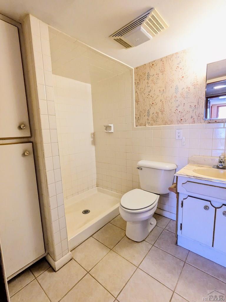 8140 Table Mountain Road Rye, CO 81069 - Photo 23 of 49 a bathroom with a toilet and a shower