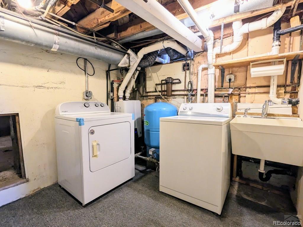 8140 Table Mountain Road Rye, CO 81069 - Photo 25 of 49 a utility room with dryer and washer