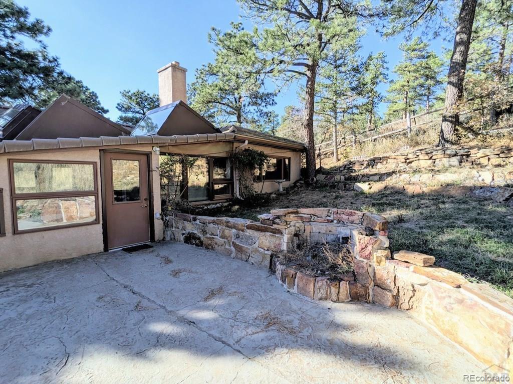 8140 Table Mountain Road Rye, CO 81069 - Photo 29 of 49 a view of a house with backyard and sitting area