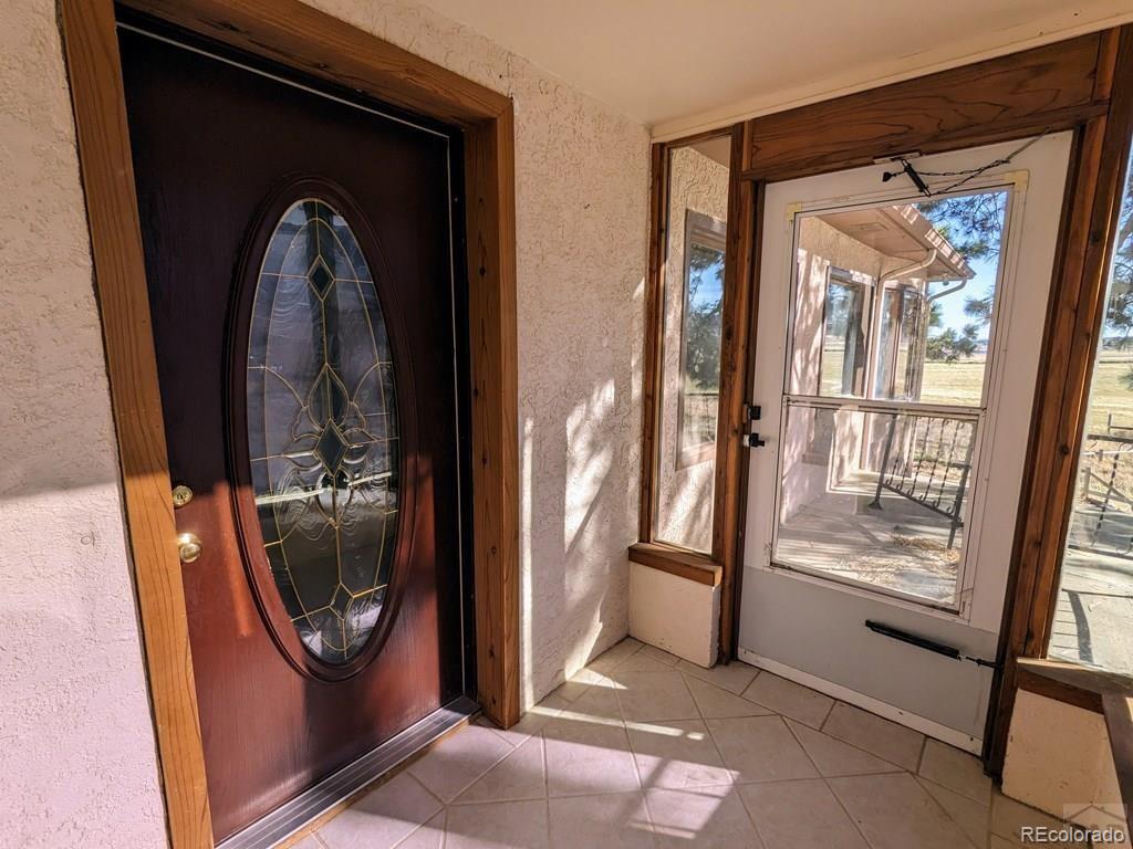 8140 Table Mountain Road Rye, CO 81069 - Photo 3 of 49 a view of a mirror on the wall and a glass door