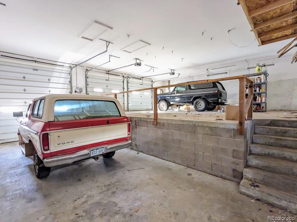 8140 Table Mountain Road Rye, CO 81069 - Photo 32 of 49 a car parked in a garage