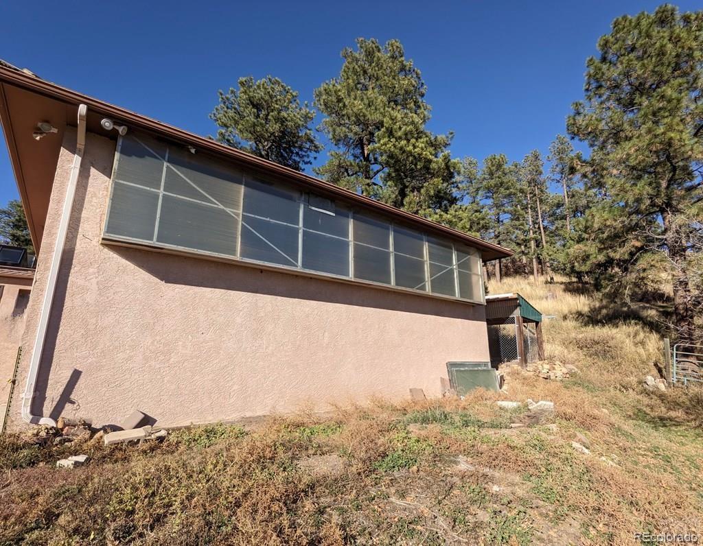 8140 Table Mountain Road Rye, CO 81069 - Photo 33 of 49 a house with trees in front of it