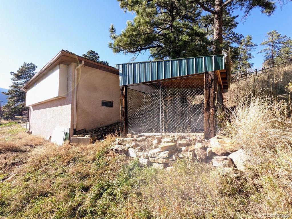 8140 Table Mountain Road Rye, CO 81069 - Photo 34 of 49 a backyard of a house with wooden fence