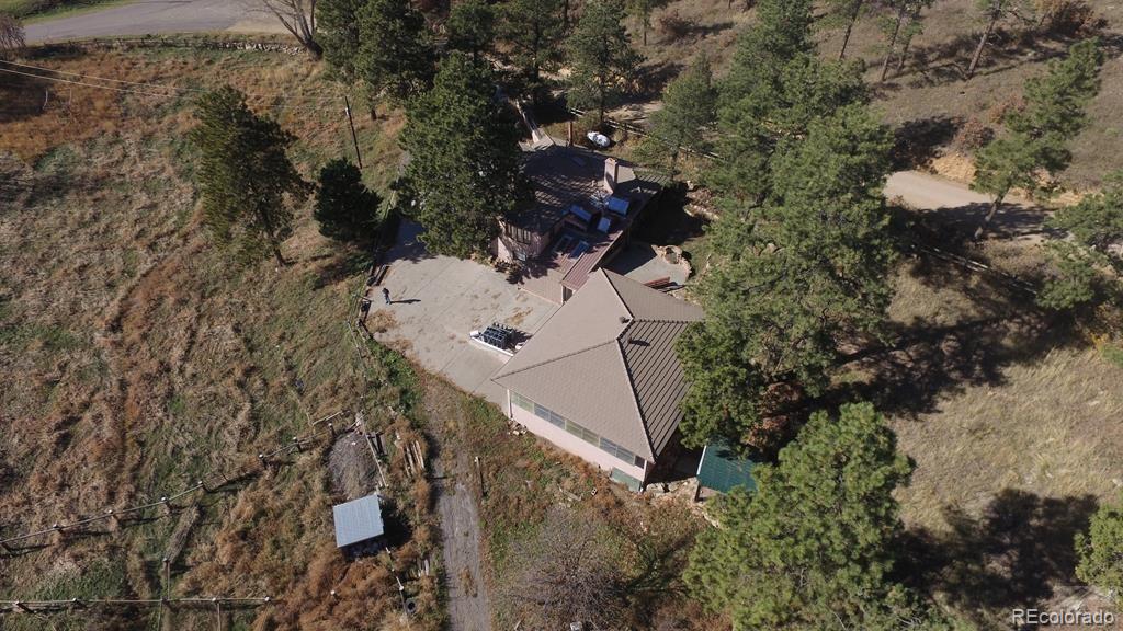 8140 Table Mountain Road Rye, CO 81069 - Photo 43 of 49 an aerial view of a house with a yard and trees all around