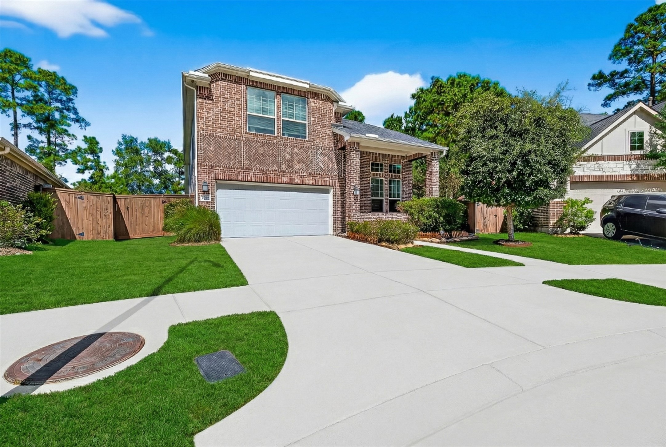 12751 Sweet Root Lane Humble, TX 77346 - Photo 2 of 29 a front view of a house with a yard and garage