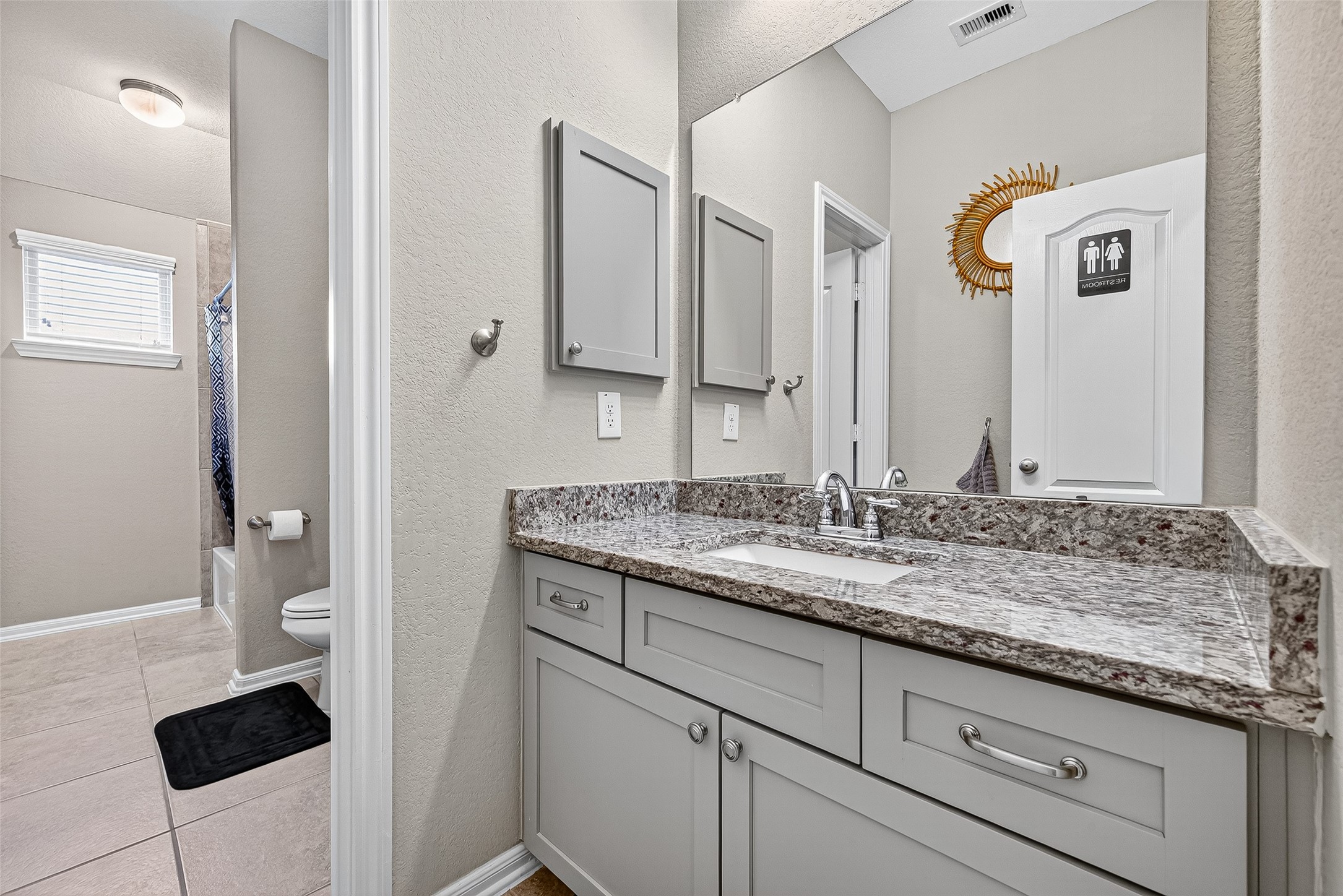 12751 Sweet Root Lane Humble, TX 77346 - Photo 22 of 29 a bathroom with a granite countertop sink and a mirror