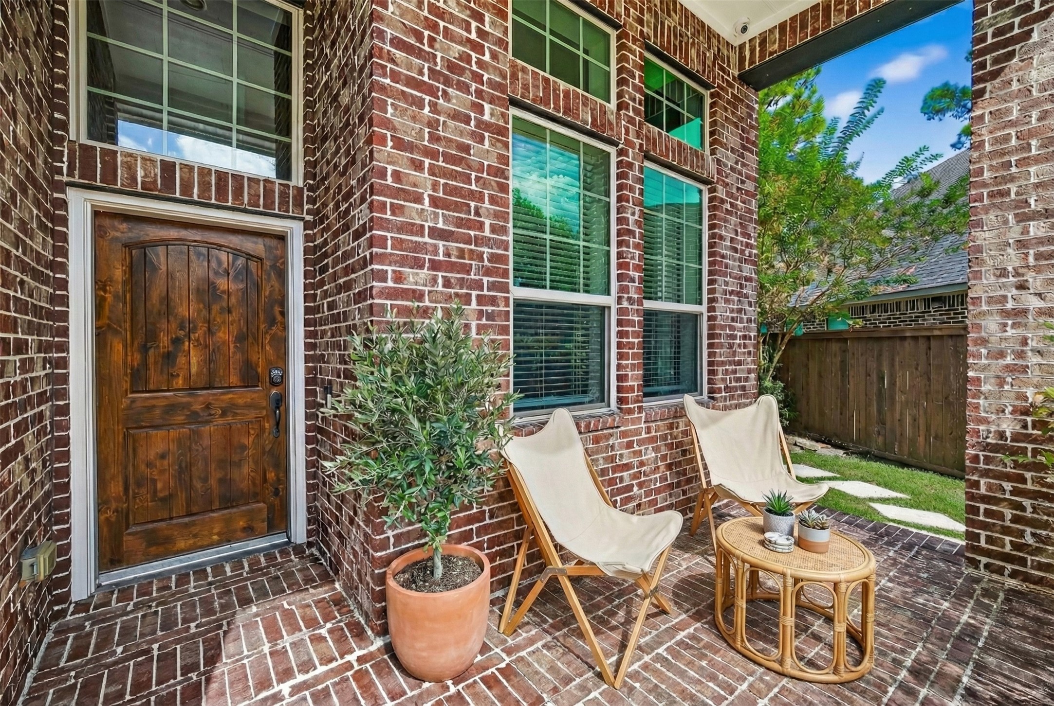 12751 Sweet Root Lane Humble, TX 77346 - Photo 4 of 29 a view of an outdoor sitting area with brick walls