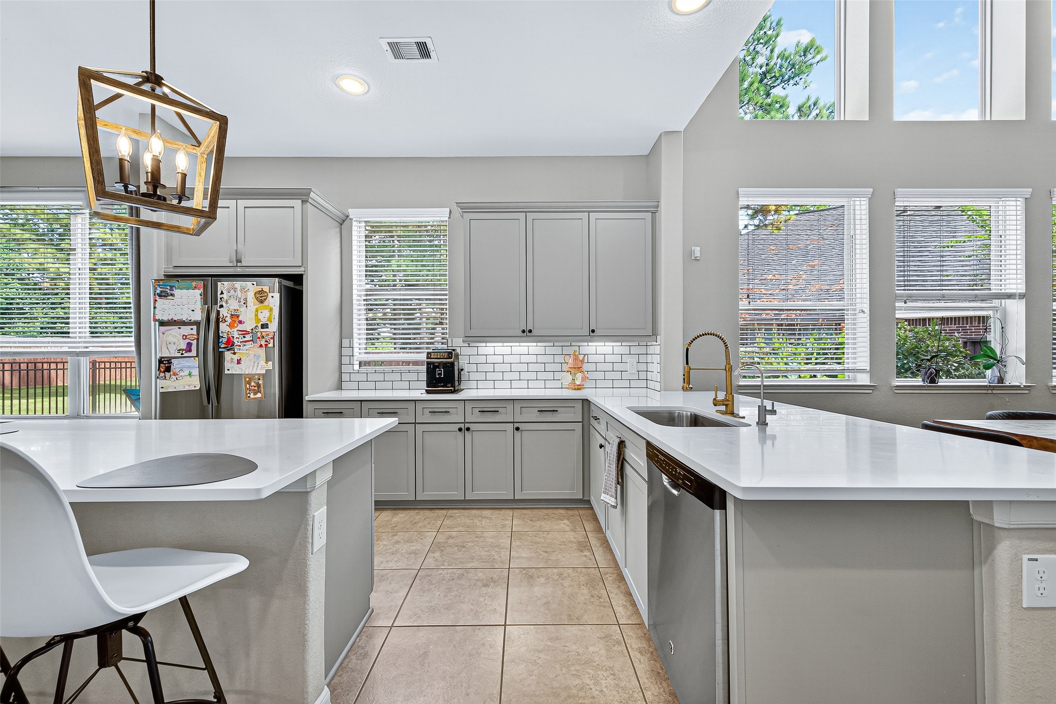 12751 Sweet Root Lane Humble, TX 77346 - Photo 8 of 29 a large kitchen with kitchen island granite countertop a sink and a stove