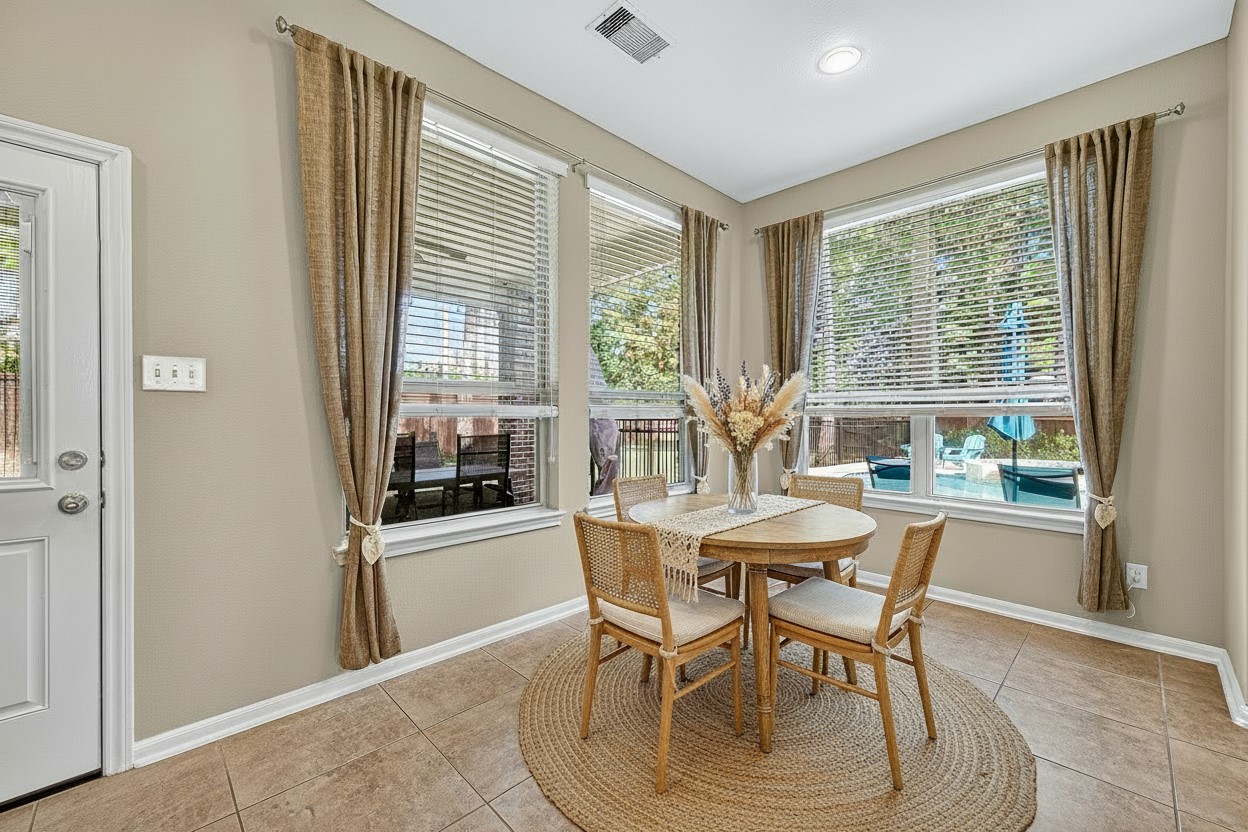 12751 Sweet Root Lane Humble, TX 77346 - Photo 9 of 29 a dining room with furniture and window