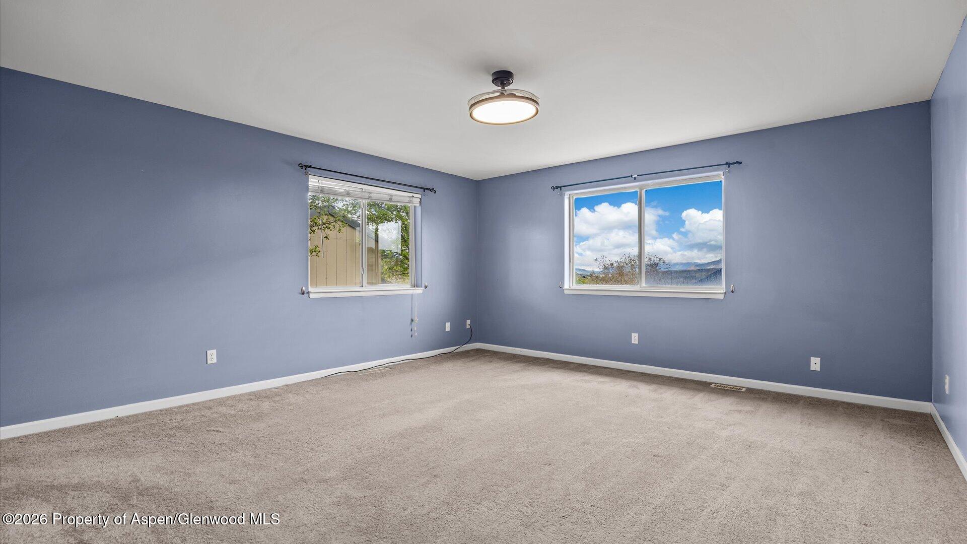 1459 Anvil View Avenue Rifle, CO 81650 - Photo 12 of 29 an empty room with windows