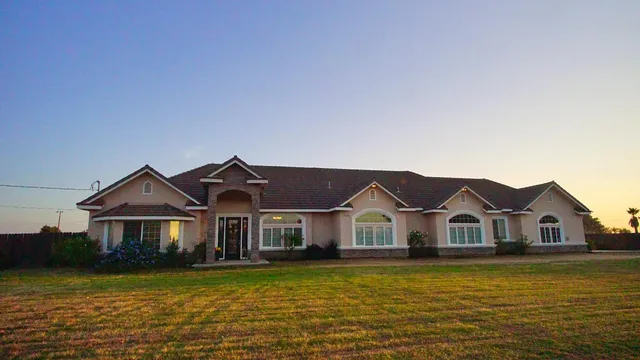 a front view of a house with a ocean view