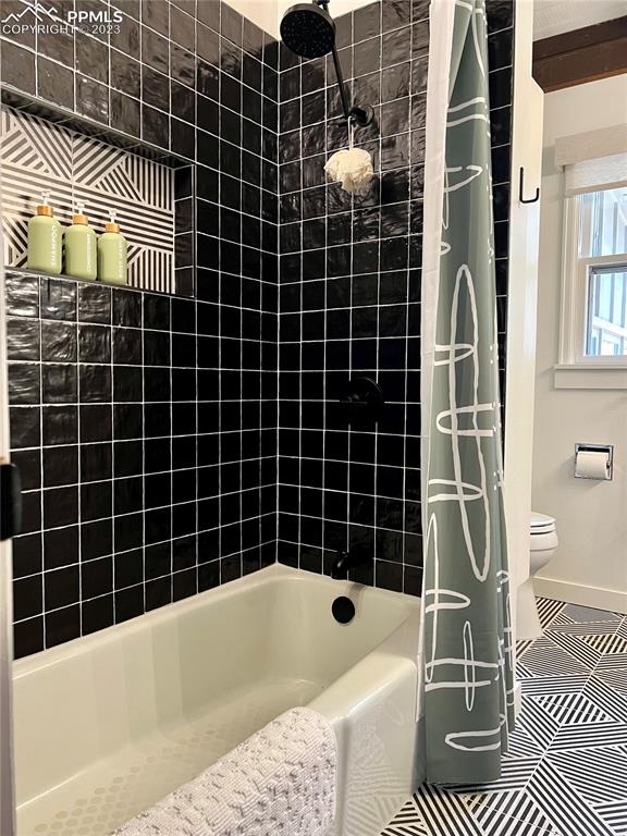 9660 Mohawk Trail Cascade, CO 80809 - Photo 24 of 42 a bathroom with a bathtub and a shower