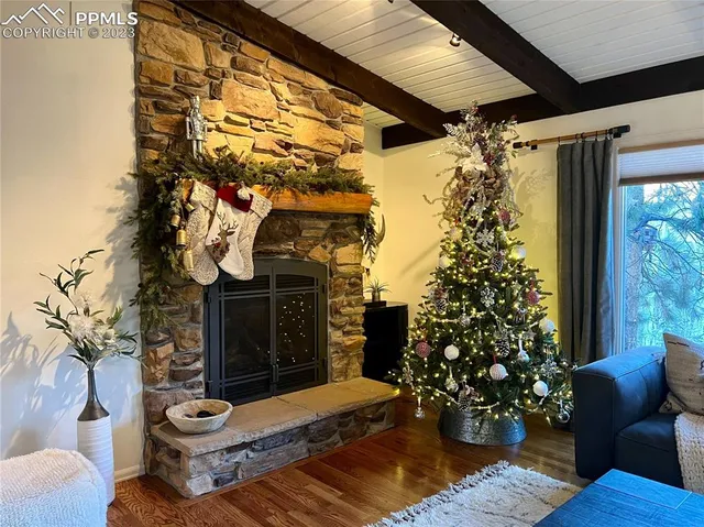 a front view of a house with outdoor seating and potted plants