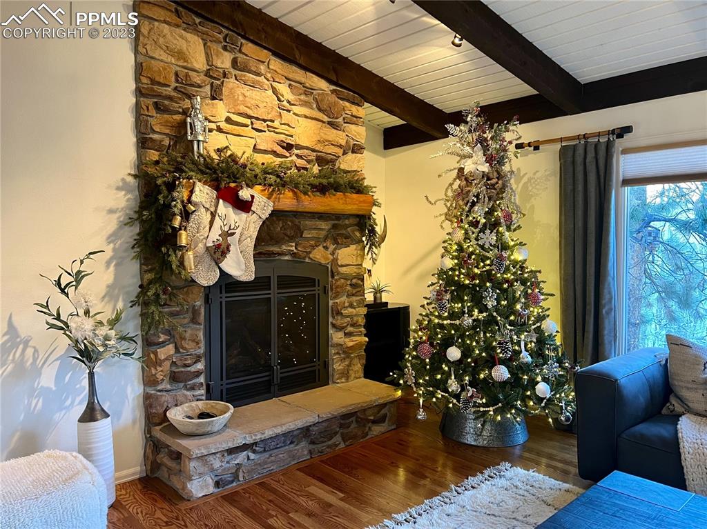 9660 Mohawk Trail Cascade, CO 80809 - Photo 3 of 42 a front view of a house with outdoor seating and potted plants