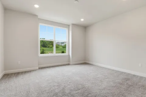 an empty room with an entryway door