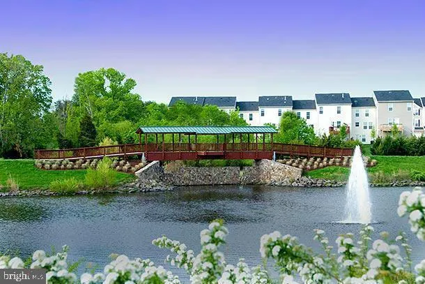 a view of a street with a bench in front of it