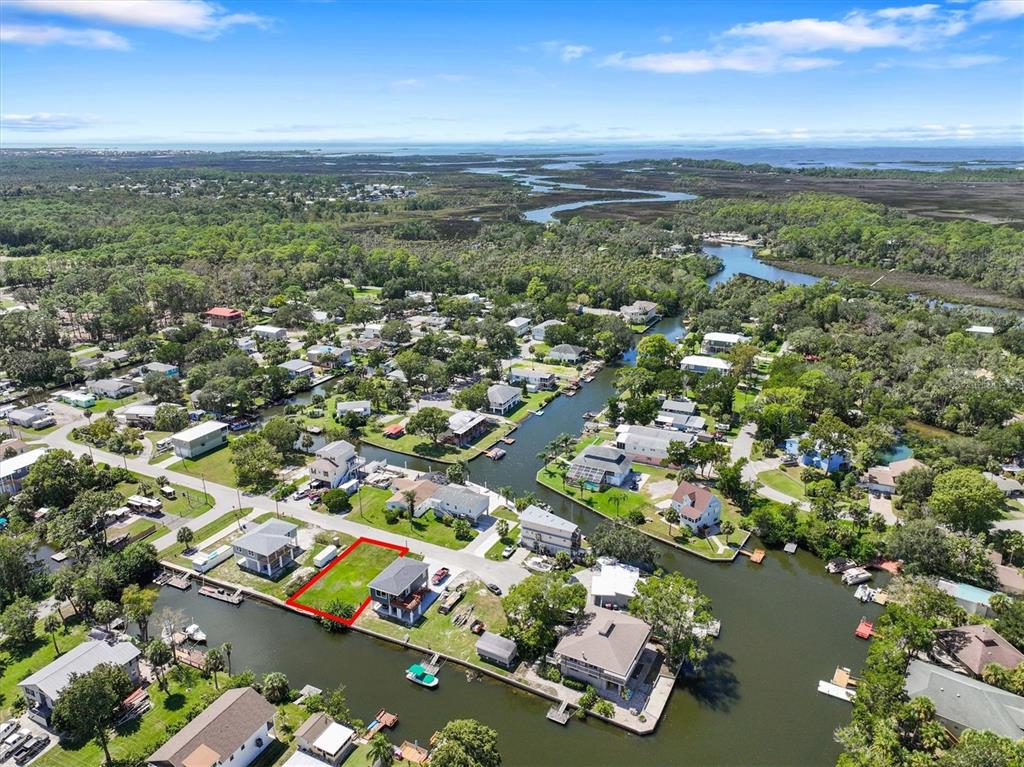 6262 Island Drive Spring Hill, FL 34607 - Photo 10 of 11 an aerial view of residential houses with outdoor space and parking