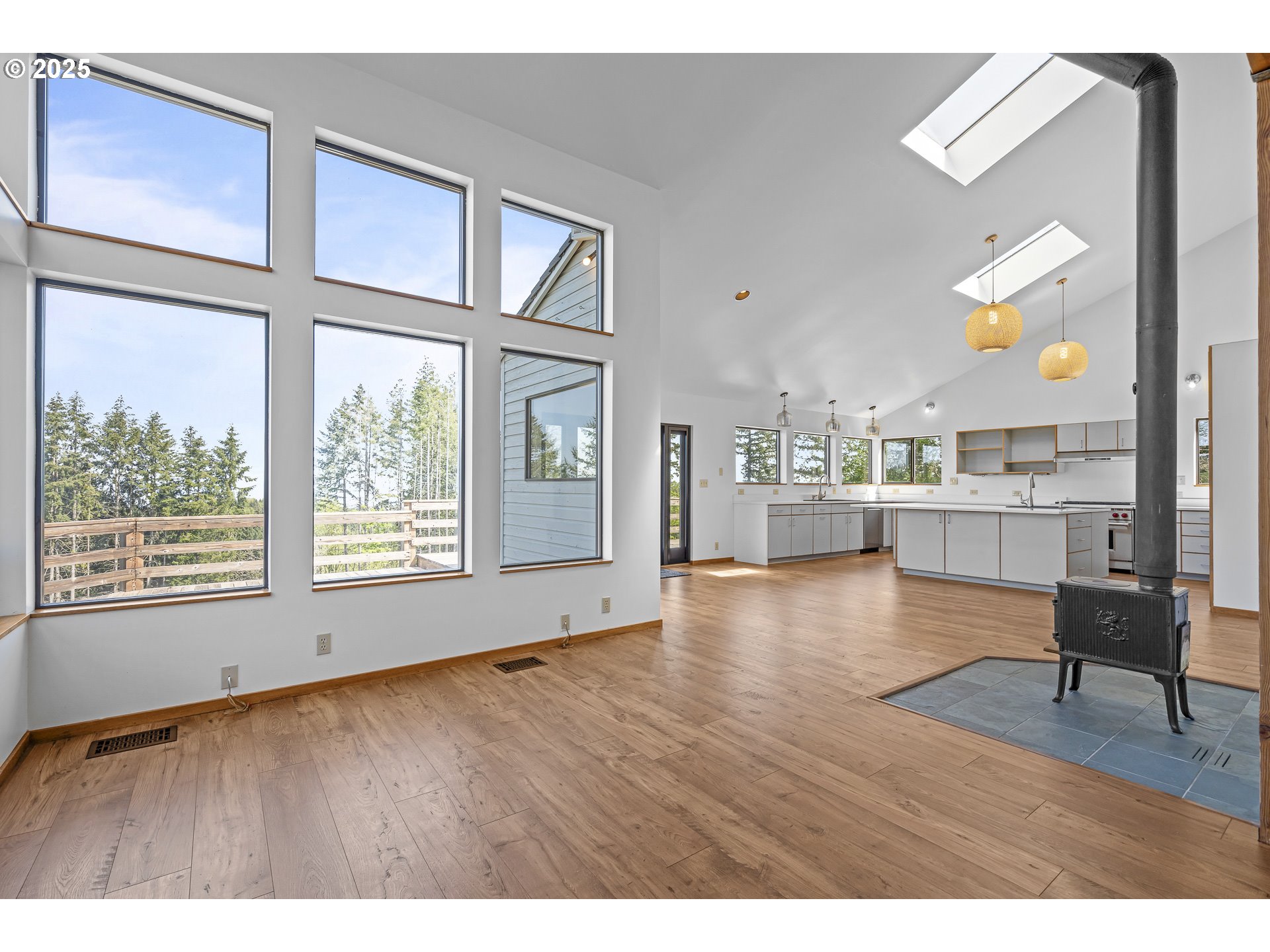 25731 Southwest Neill Road Newberg, OR 97132 - Photo 12 of 39 a view of an empty room with a window and wooden floor