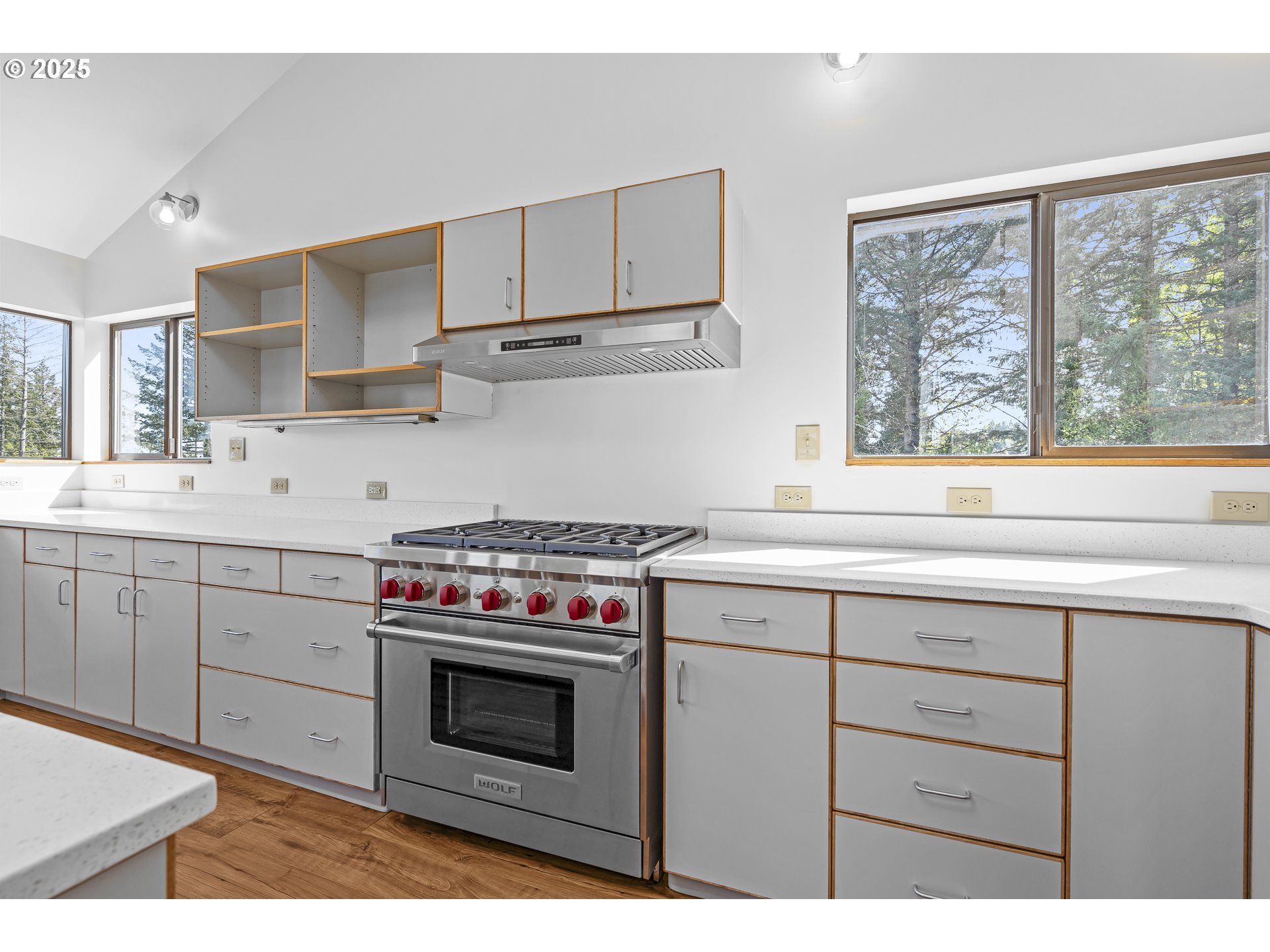 25731 Southwest Neill Road Newberg, OR 97132 - Photo 8 of 39 a kitchen with stainless steel appliances white cabinets and a stove top oven