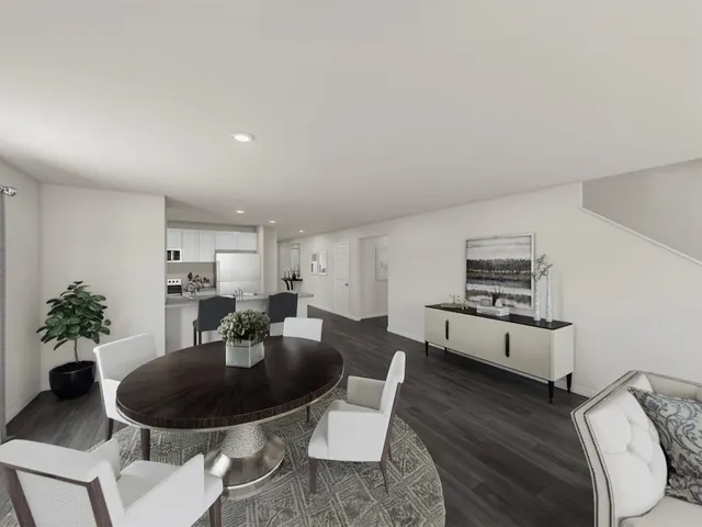 a living room with furniture potted plant a sink and a potted plant